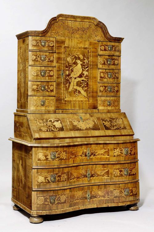 A TABERNACLE BUREAU CABINET, Baroque, South Germany, 18th century. Walnut richly inlaid in the form of birds, flower garlands and vases. Bronze mounts. 126x65(86)x205 cm. 1 key. Minor losses.