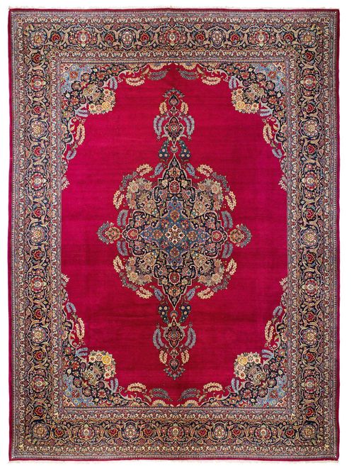 KESHAN old. Blue central medallion on a red ground with blue corner motifs, colorful flower motifs, blue border, good condition. 320x435 cm.