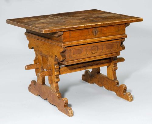 BOX TABLE, from the Alpine region, probably Germany, 18th century. Walnut and oak, inlaid &quot;LH 10 MAI&quot; and carved with geometric friezes and rosettes. Rectangular, slidable leaf opens up a compartment. Bread drawer. 82x103x78 cm. Compartment and drawer with alterations.