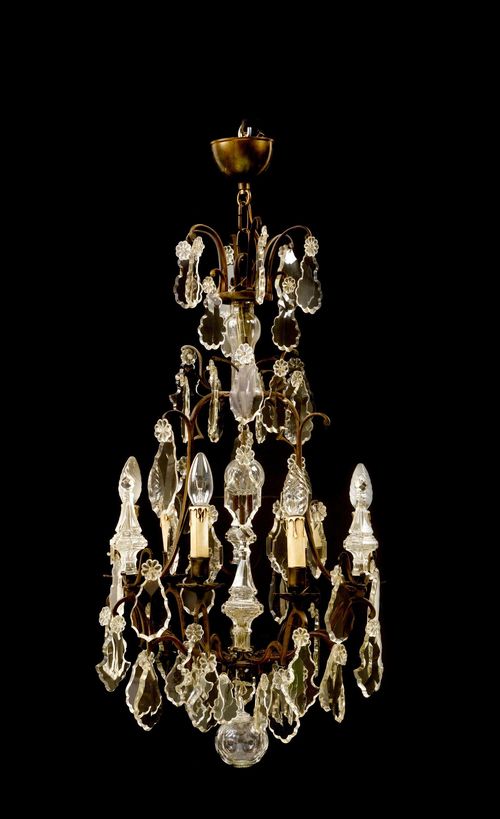 CHANDELIER,in the Baroque style, 19th century. Pierced, pear-shaped frame with 6 light branches. Cut glass designed as leaves and baluster. D 47, H 97 cm. Fitted for electricity.