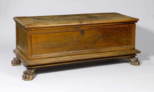 CHEST,late Baroque, Italy. Walnut. Rectangular body with slightly protruding hinged cover. Carved claw feet. Front and sides, panelled. 168x61x66 cm.