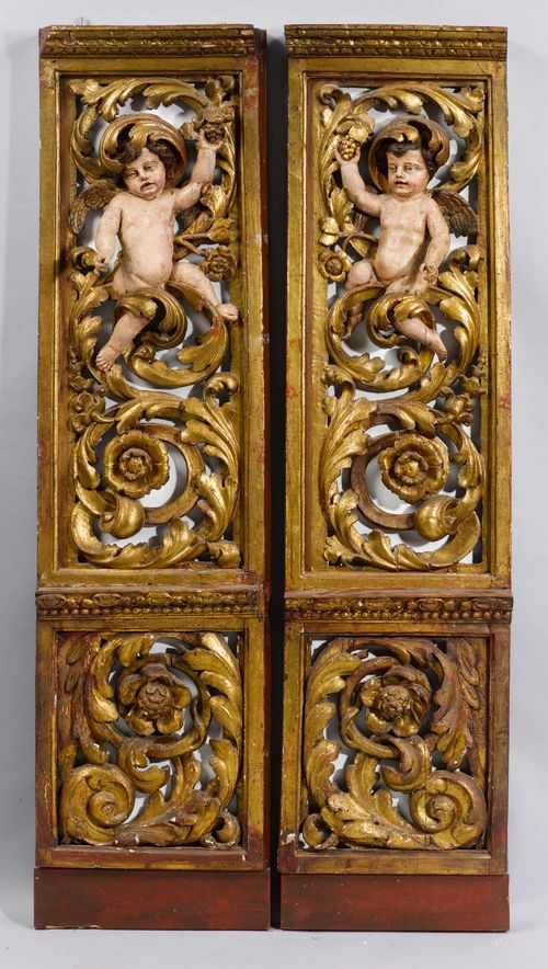 PAIR OF CARVED ALTAR ELEMENTS,mounted as a room divider, late Baroque, 19th century, probably from Spain. Pierced wood carved with leaf volutes, flowers and putti. Rectangular, verso with mirror. Each 211x51 cm. Some losses, putti missing fingers.