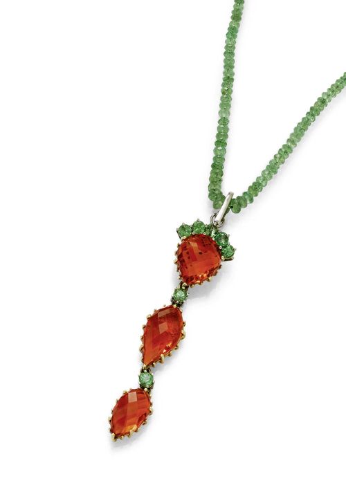 FIRE OPAL AND PERIDOT NECKLACE WITH EAR PENDANTS AND RING. Yellow and white gold 585, ear studs 750. Attractive necklace of numerous facetted peridot beads of ca. 2 - 4.7 mm Ø, L ca. 42 cm, removably mounted thereon: 1 long pendant of 3 drop-cut fire opals in a fantasy cut of ca. 12.7 x 14.1, 18.8 x 10.5 and 15.4 x 9.4 mm, and additionally decorated with 7 peridots weighing ca. 1.30 ct in total. L ca. 7.9 cm. Matching ear pendants, each of 1 drop-cut fire opal of ca. 13.5 x 9.3 mm, flexibly mounted below 2 peridots weighing ca. 0.80 ct in total. Matching ring, the top set with 1 oval fire opal of ca. 15.4 x 11.9 mm, within a border of 14 peridots weighing ca. 1.90 ct. Size ca. 57. With case.