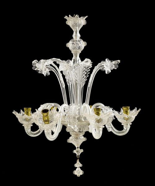 CHANDELIER,Baroque style, Murano, 20th century. Colourless glass. 6 curved light branches on a baluster shaft. Decorated with flowers and leaves. H 60, W 50 cm. Incomplete. Fitted for electricity.