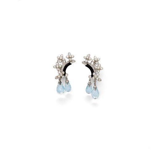 TOPAZ, DIAMOND AND ONYX CLIP EARRINGS. White gold 750. Each set with 1 onyx, round diamonds, and 2 topaz briolettes. Total weight of the topazes ca. 7.90 ct and total weight of the diamonds ca. 1.10 ct. L ca. 4.2 cm.