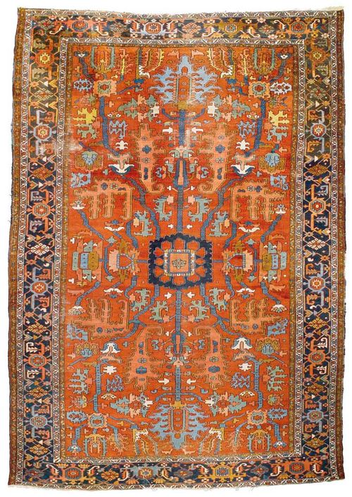 HERIZ antique.Red central field with stylized plant motifs in shades of pink and blue, dark blue border, signs of wear, 430x290 cm.