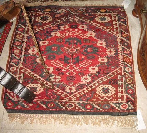 SMALL BERGAMA old.Red ground with a hexagonal central medallion, geometrically patterned, narrow border, restored, 96x91 cm.