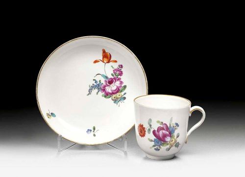CUP AND SAUCER, Pfalz-Zweibrücken, circa 1770.Each piece painted with floral bouquets and scattered flowers. Gilt edges. PZ Monogramm mark in blue. Incised mark FI and. I. Gilding rubbed Provenance: from a Swiss private collection.