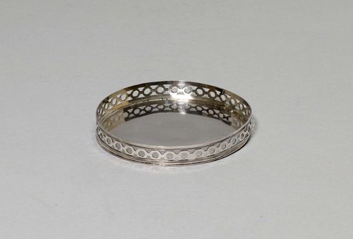 BOTTLE COASTER,20th century. Unmarked. Pierced edge. Some repairs. D 13 cm, 115 g.