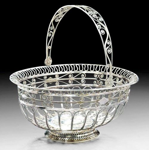 SILVER WIRE BASKET. Bern, 1st quarter of the 19th century.Maker's mark  Rehfues & Co. A filigree basket set on an oval openwork foot. L 26 cm. 550 g.