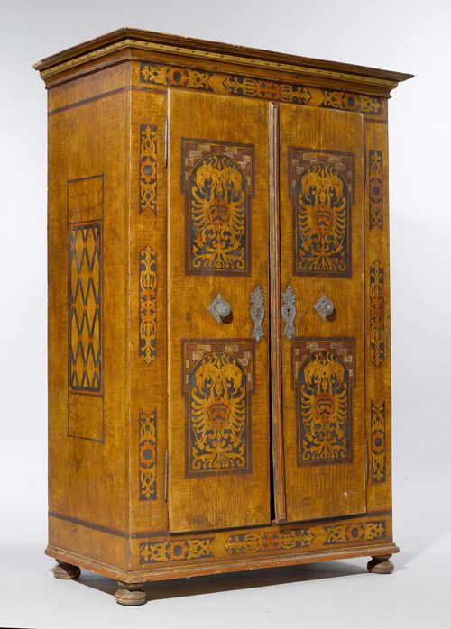 PAINTED CABINET,Austria, probably Tyrol, 18th century. Grained pinewood, painted with stylised fleurons and 4 reserves with a double-headed eagle. Rectangular body. Front with double-doors, the inside with 2 drawers. Metal mounts. 118x60x170. 1 key.