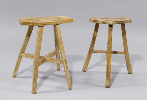 TWO STOOLS,in the rustic style. Hardwood. Kidney-shaped seat, one with 3, the other with 4 legs. L 33, H 50 cm and L 39, H 50 cm.
