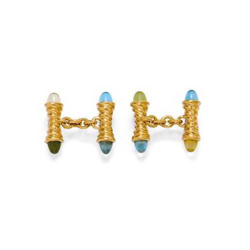 GEMSTONE AND GOLD CUFF LINKS, TAMARA COMOLLI. Yellow gold 750, 20g. Decorative, twin cuff links, each of 1 spirally, ribbed gold cylinder with four different gemstones, such as citrine, topaz, aquamarine and tourmaline, at the ends.