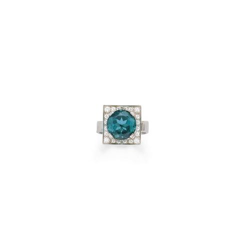TOURMALINE AND DIAMOND RING. White gold 750. Classic ring, the square, concave top set with 1 round, blue-green tourmaline weighing ca. 6.40 ct, signs of wear, and set throughout with 36 brilliant-cut diamonds weighing ca. 0.80 ct in total. Size ca. 58.