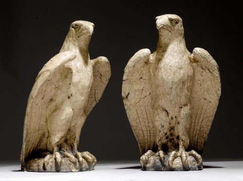 PAIR OF EAGLES,in the style of Louis XV. Terracotta, painted grey. Perching bird with head turned to the right. H 69 cm. Some chips.