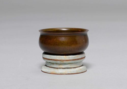 A SMALL BRONZE CENSER. China, ca. 18th c. Diameter 6.8 cm. Seal mark on base. Pedestal of woven material.