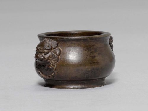 A BRONZE MINIATURE OF AN INCENSE BURNER WITH LION MASKS. China, 18th/19th c. Diameter 5 cm. Height 3.5 cm. Cast mark on base: "Xuan".