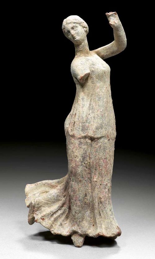 FIGURE OF A DANCER,Sicily/Centuripe, 2nd century BC Fired brick red clay with remains of old paint. Some losses. H 22 cm. Provenance: from a French private collection, acquired in  1972.