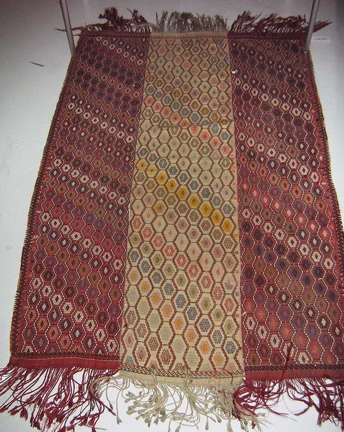 ANATOLIAN KILIM old.Consisting of two red bands and one beige band, honeycomb patterned with lozenges adorned with latch hooks, signs of wear, 215x140 cm.