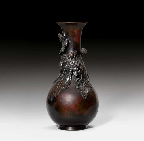 A DARK BROWN PATINATED BRONZE VASE OF PEAR SHAPE CARVED WITH LOTUS PETALS AND FROG IN HIGH RELIEF. Japan, 19th c. Height 34 cm.