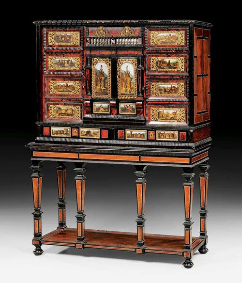 CABINET ON STAND,Renaissance, Flemish, probably Antwerp circa 1650/1700. Ebonised and shaped wood inlaid with red tortoiseshell and ivory fillets. The drawer fronts with finely painted landscapes with ruins and views on stone. The cabinet with overhanging shaped cornice and later stand, with 8 tapering legs, plinth base and bun feet. The front with central door between 2 drawers with baluster rail, flanked by 4 drawers each side with ebonised mouldings. Bronze and brass mounts. 114x42x158 cm. Provenance: Swiss private collection