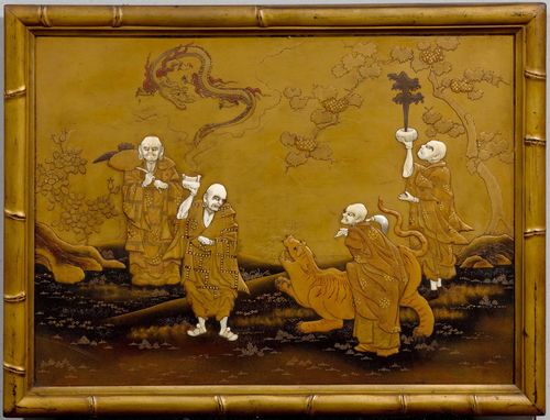 GOLD-, BLACK AND RED-LACQUERED PANEL WITH IVORY AND MOTHER-OF-PEARL INLAYS DEPICTING FOUR RAKAN WITH A LION AND DRAGON SPIRIT. Japan, Meiji period, 30x41 cm. Paint and gold leaf details. Framed. Minor damage and additions.