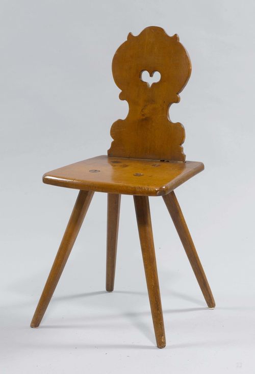 STABELLE, from the Alpine region, 19th century. Walnut and beech. Trapezoid seat on inclined legs. Backrest with a heart-shaped piercing.
