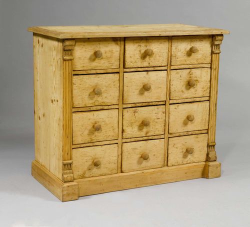 CHEST OF DRAWERS,Historicism, 19th century. Pinewood. Rectangular chest, the front with 12 drawers, between fluted lisenes. 106x49x90 cm. Formerly painted.