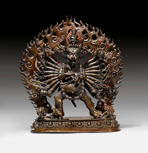 A BRONZE FIGURE OF YAMANTAKA. Tibet, 20th c. height 49 cm. Removable flaming aureole. Traces of red cold painting.