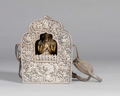 A SMALL SHRINE OF COPPER WITH A SILVER COVER, A GILT COPPER ALLOY FIGURE OF SHADAKSHARI WITHIN. Tibet, antique, height 10.5 cm.