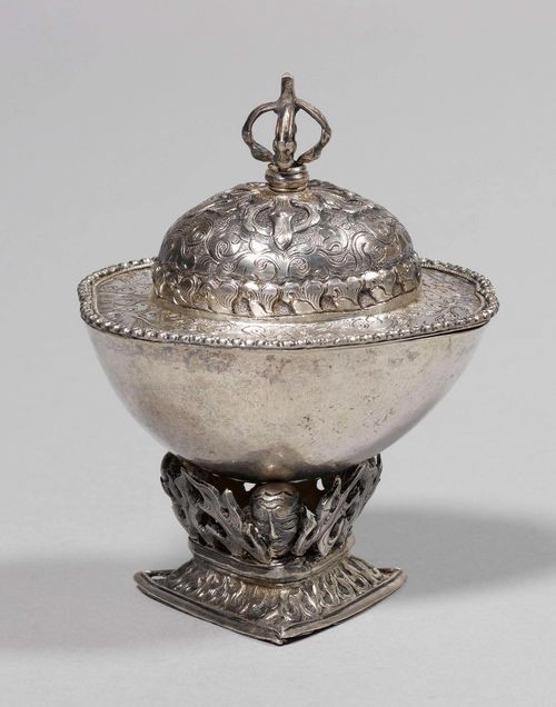 A SMALL KAPALA WITH COVER AND BASE OF CHASED AND ENGRAVED SILVER, AND BOWL OF SKULL. Tibet, antique, height 11.5 cm.