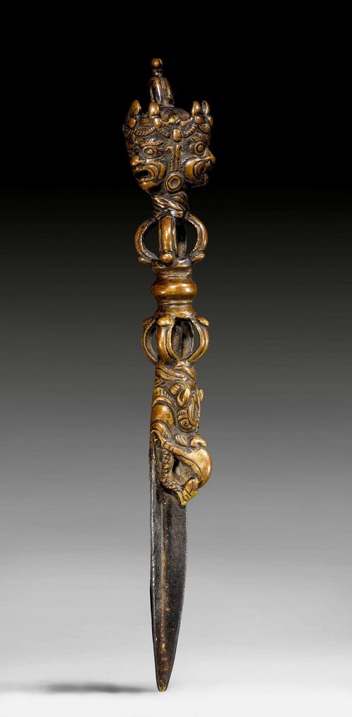 A BRONZE AND IRON PHURBU. Tibet, antique, length 24 cm.