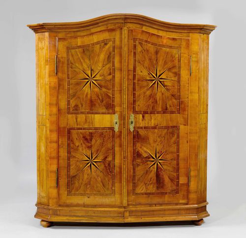 INLAID CUPBOARD,Switzerland, end of the 18th century. Walnut and fruit woods inlaid with friezes, reserves and star motifs. Front with double-doors. Brass mounts. 174x51x193 cm. 1 key.