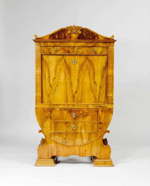 LYRE BUREAU CABINET,late Biedermeier, probably Germany, 2nd half of the 19th century. Walnut. Body designed as a lyre.  Front with hinged writing surface opening up into 2 compartments and 8 drawers. 1 drawer on top and 2 drawers on the bottom. Brass mounts. 102x46(99)x170 cm. 3 keys. Some losses.