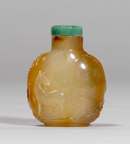 A PALE AGATE SNUFF BOTTLE CARVED WITH TWO HORSES AMONG TREES AND AN INSCRIPTION. China, 20th c., height 7 cm. Jade stopper. Tip of spoon broken.