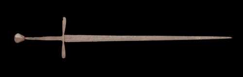 SWORD,German, ca. 1400. Corroded iron. Long, chivalric sword with a solid mushroom-shaped pommel. S-shaped, long quillion. Double-bladed sword. Total length 109 cm. Provenance: - from a Zurich private collection.
