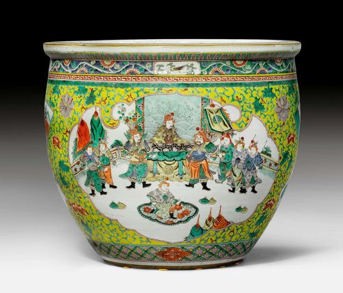 A LARGE FAMILLE VERTE CACHEPOT SHOWING FIGURATIVE SCENES IN TWO RESERVES WITH AN ALLOVER PATTERN OF FLOWERING VINES ON A YELLOW GROUND. China, mid-20th c., height 35 cm, diameter 40.5 cm.