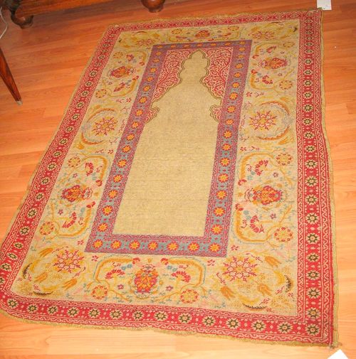 HEREKE PRAYER, antique.Beige mihrab with red spandrels, broad border with trailing flowers in delicate pastel colours, worn, 148x98 cm.