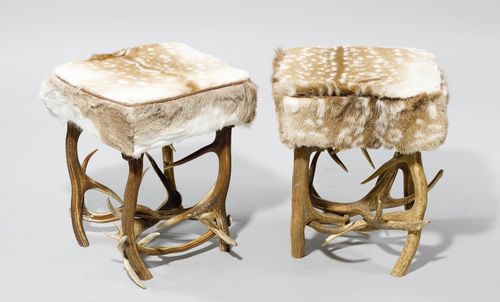 PAIR OF STOOLS WITH FALLOW DEER HIDE,in the rustic style. Rectangular seat on a deer antler frame. 45x45x54 cm.