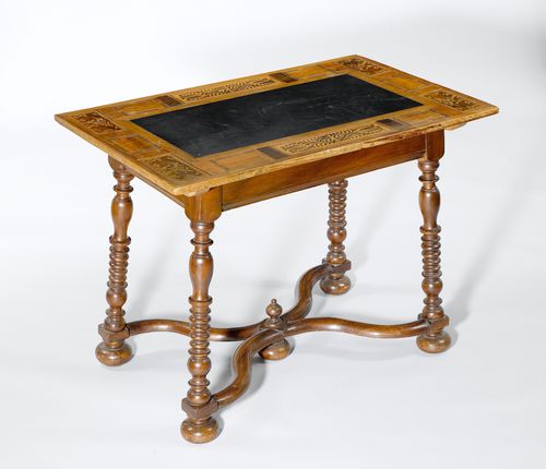SMALL SLATE TABLE,Baroque, Switzerland, probably Grisons, 18th century. Walnut and other woods, inlaid with mythical creatures, leaves and rectangular reserves. Top inlaid with slate. Turned legs. 101x64x76 cm.