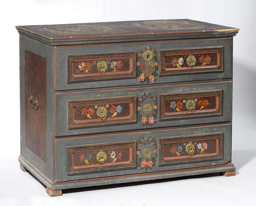 PAINTED CHEST,from the Alpine region, dated 1849. Pinewood, carved with decorative friezes and painted with flowers. Rectangular body with hinged cover, and square feet. Front with 3 drawers, the top a sham drawer. Brass mounts. 124x60x92 cm. Some losses. Key missing.