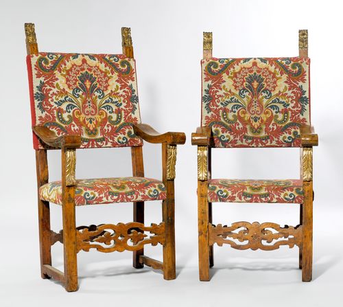 PAIR OF ARMCHAIRS,Renaissance, Italy. Walnut, carved with acanthus leaves, and gilt. Rectangular, padded seat and padded backrest. Florally patterned "gros-point" cover. 63x58x134 cm. Repairs and alterations.