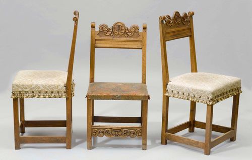 SUITE OF 3 SIMILAR CHAIRS, Renaissance style, 19th century. Carved walnut. One with leather seat, two with light coloured fabric cover.
