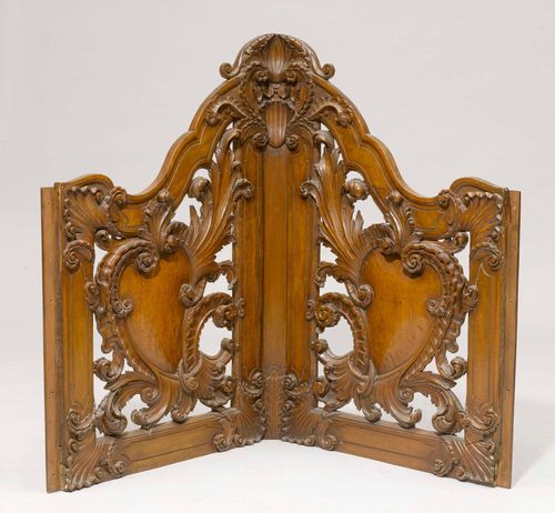 CARVED CORNER ELEMENT, Baroque and later, Northern Italy. Walnut with openwork carving. H 105 cm. With fabric-lined elements to be fitted as bed head.