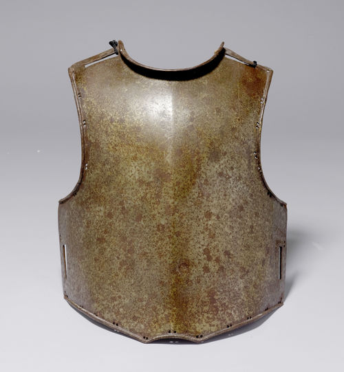 CUIRASSIER CHEST PROTECTOR,German or Swiss, 1st half of the 18th century. Forged iron, small perforations on the side, with a broad slit in the arm region. Probably a chest protector for a horseman, which did not have a back plate. Fastened by means of broad straps on the shoulders and at the waist. Small lateral perforation for fixing the inside padding.
