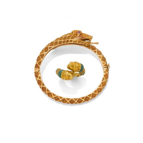 TWO BRACELETS AND ONE RING, LALAOUNIS. Yellow gold 750, 100 g. Hinged, textured bracelet designed as a coiled snake, with 2 rubies as eyes. Ca. 6 x 5 cm. Double-row gold bracelet, the centre with  a Herakles knot, L ca. 17.5 cm. Matching ring with lion heads, and decorated with 4 aventurine quartz beads. Size ca. 53.