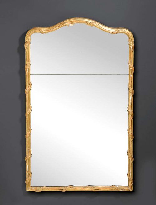 CARVED GILTWOOD MIRROR,late  Louis XV, probably  German , 18th century H 140 cm, W 81 cm.