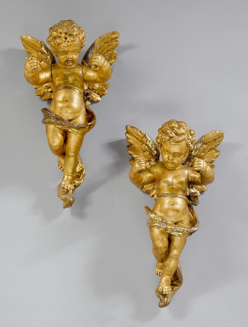 PAIR OF ANGELS, PART OF A CANDELABRA,ca. 1880/90. Wood, carved all-around and gilt. H57 cm. Candelabras missing. Gilding later.