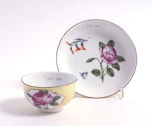 SMALL CUP AND SAUCER WITH YELLOW GROUND, Meissen, circa 1745.Painted with Holzschnittblumen after an engraving and scattered floral sprays. Underglaze blue sword mark, impressed number. Slightly rubbed. Provenance: private collection, Basel.