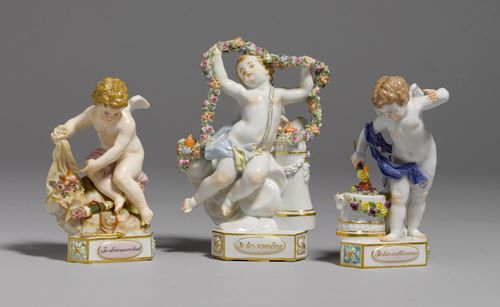 THREE PUTTI WITH HEARTS: "JE DECOUVRE TOUT" , ''JE LES ENFLAMME", "JE LES RAMÊNE",Meissen, ca. 1880/after 1934. All on a triangular base. One putto seated on a rock with two hearts bedded on roses. One putto lighting a heart with a torch. One putto holding a long flower garland over two flaming hearts. Underglaze blue sword marks, the first figure with pommels, model number F. 13 incised, F4 and 60212 impressed, additional press numbers. H 13 cm and 15 cm. Small chips on the band of the quiver, and on the blossoms and leaves. (3)